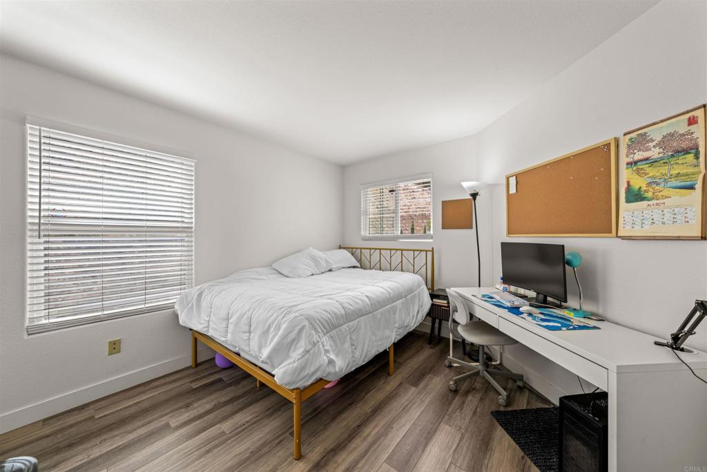 2007 Pleasant Waters Court Spring Valley, CA 91977 - Photo 17 of 22 a bedroom with a bed and a desk
