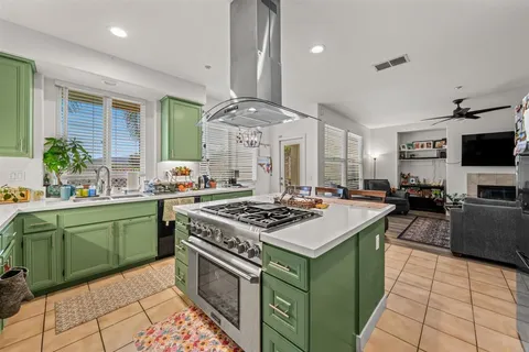 a kitchen with a stove top oven sink and cabinets