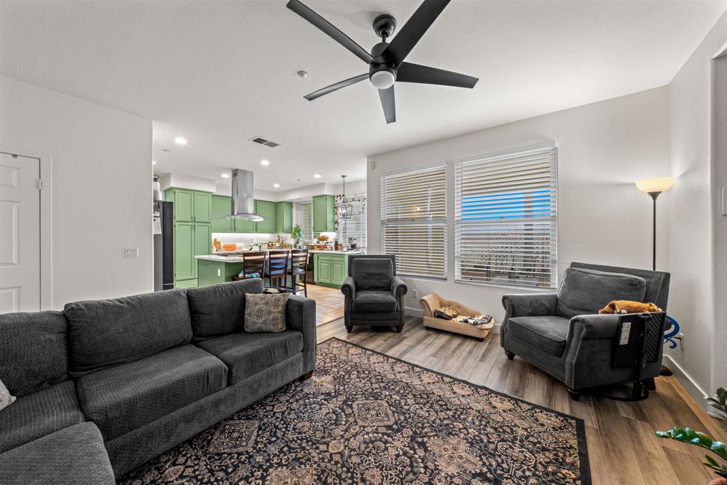 2007 Pleasant Waters Court Spring Valley, CA 91977 - Photo 8 of 22 a living room with furniture ceiling fan and a window