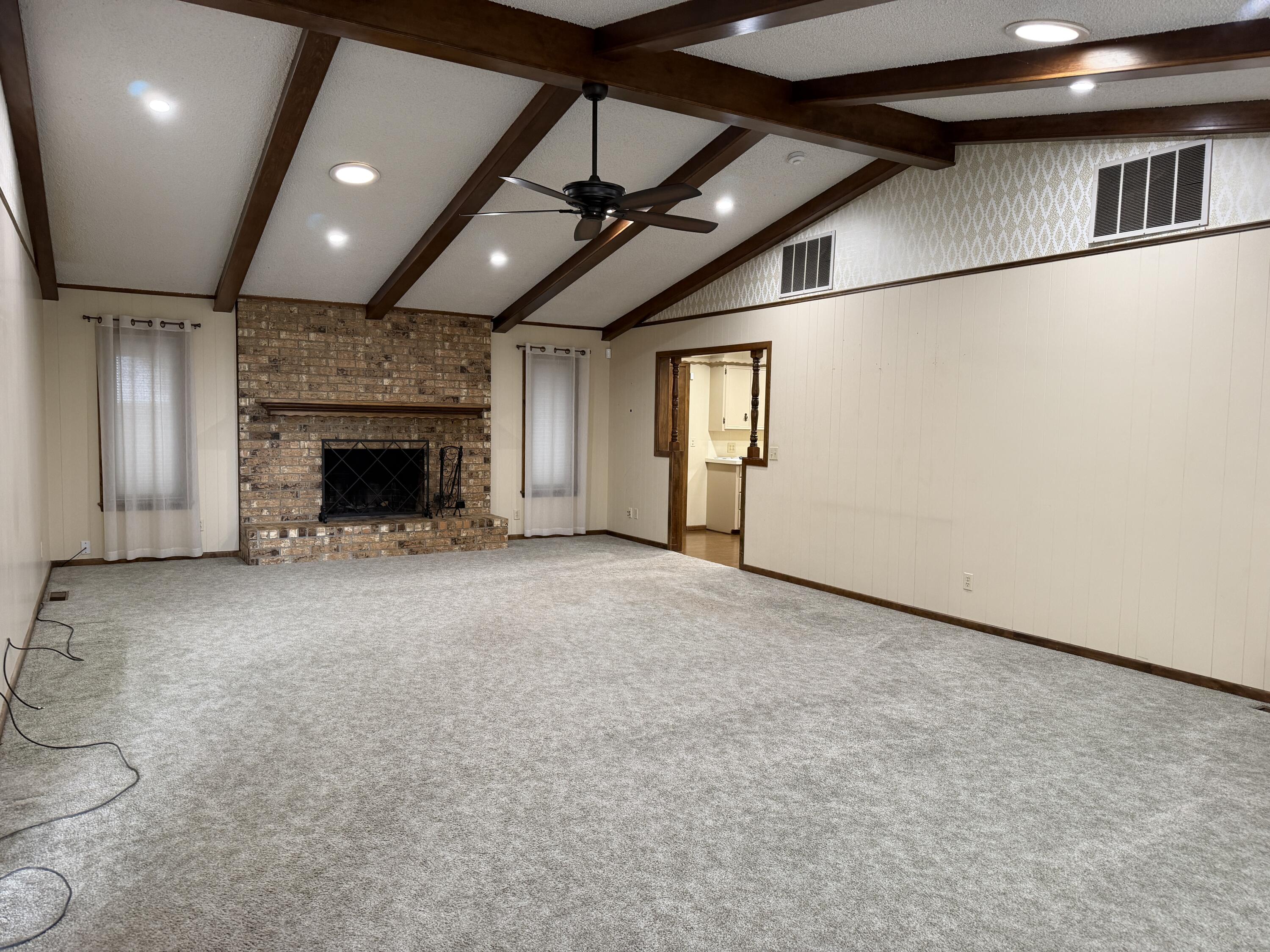1603 South 8th Street Lamesa, TX 79331 - Photo 2 of 39 a view of empty room with a fireplace
