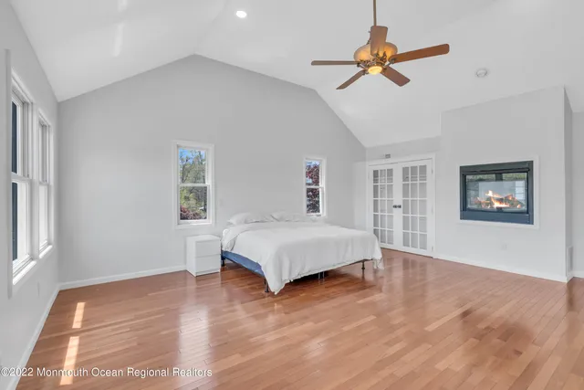 a bedroom with a bed dresser and a window