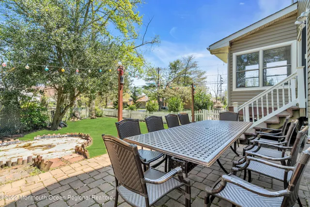 a view of a patio with a table chairs and a table
