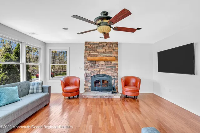 a living room with furniture fireplace and a flat screen tv