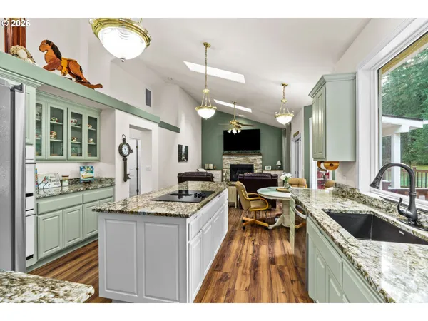 a kitchen that has a lot of cabinets in it