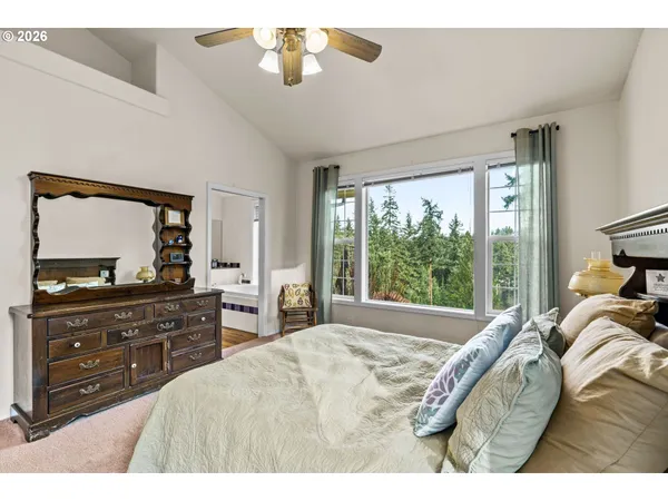 a bed room with a bed and a television