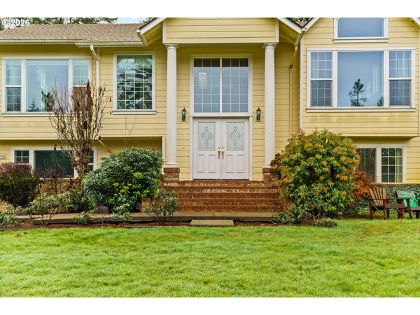 a front view of a house with a yard