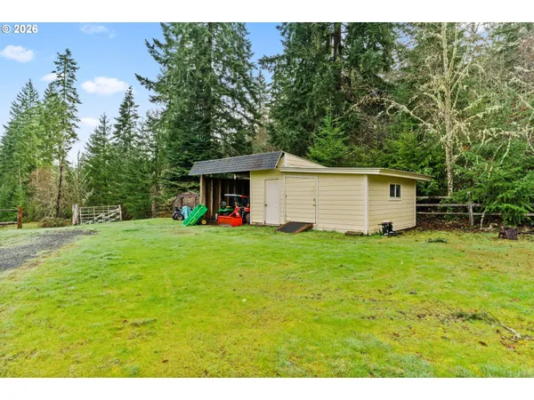 a view of a backyard with table and chairs and potted plants