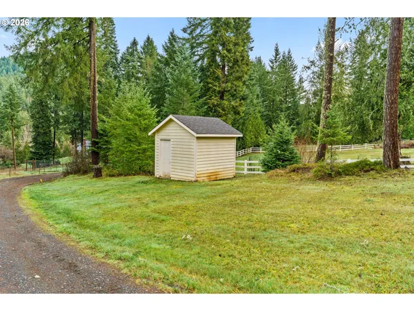 a backyard of a house with lots of green space