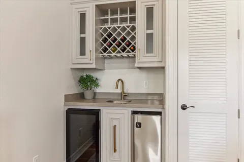 a kitchen with a sink and a potted plant