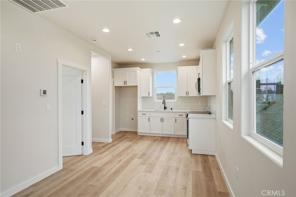 243 West 3rd Street Tracy, CA 95376 - Photo 17 of 29 a large kitchen with a lot of counter space and stainless steel appliances