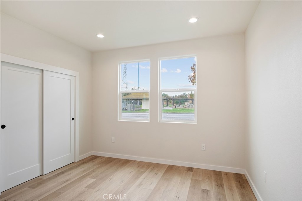 243 West 3rd Street Tracy, CA 95376 - Photo 20 of 29 a view of room with window and hardwood floor