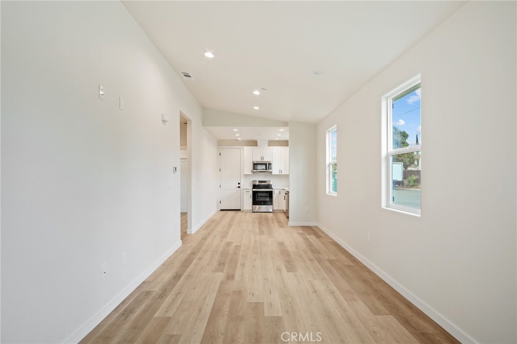 243 West 3rd Street Tracy, CA 95376 - Photo 29 of 29 a view of a big room with wooden floor and windows