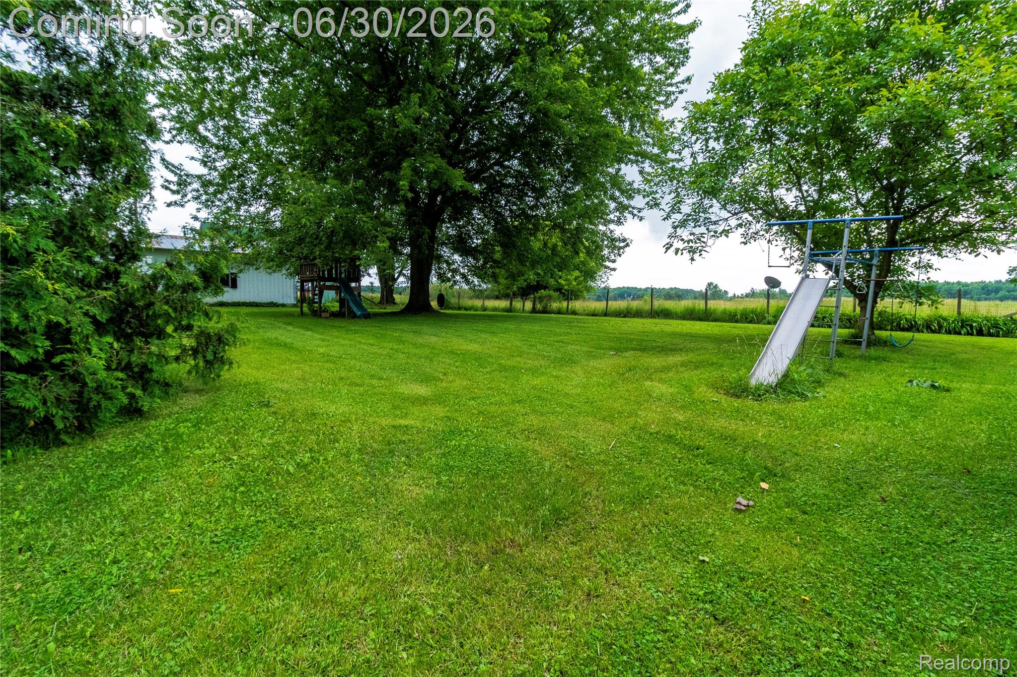 8150 Norman Road Imlay City, MI 48444 - Photo 40 of 58 Expansive green lawn with mature trees providing extensive canopy