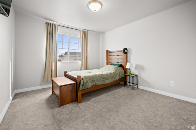 3359 Eurasian Crane Road Clinton, UT 84015 - Photo 32 of 71 Bedroom with light carpet