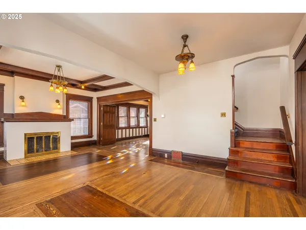 a view of an entryway with wooden floor