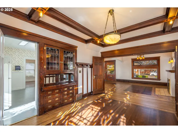 a view of an entryway with wooden floor