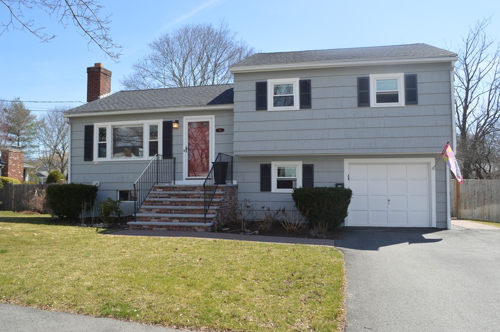 39 Miriam Road Waltham, MA 02451 - Photo 1 of 20 a front view of a house with a yard