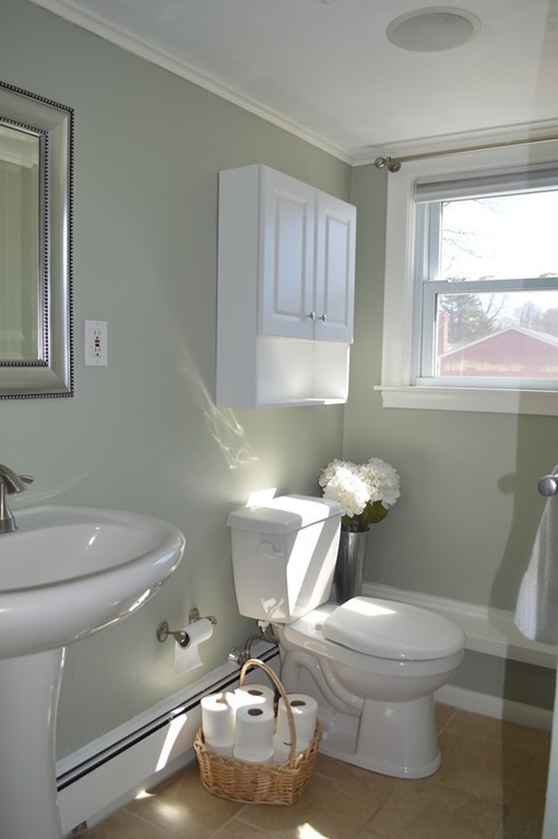 39 Miriam Road Waltham, MA 02451 - Photo 12 of 20 a bathroom with a toilet a sink and a mirror