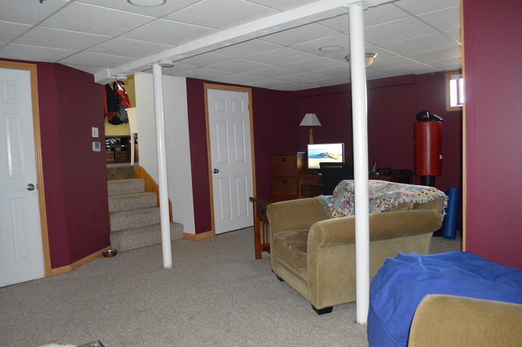 39 Miriam Road Waltham, MA 02451 - Photo 14 of 20 a living room with furniture and a hallway