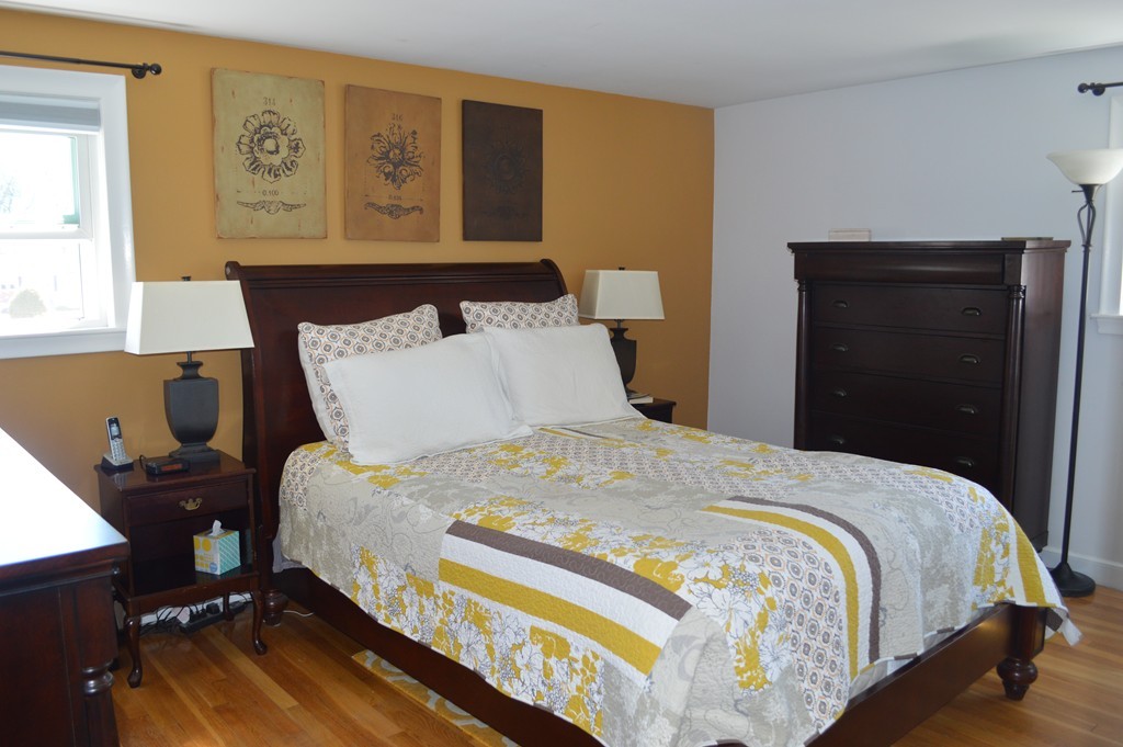 39 Miriam Road Waltham, MA 02451 - Photo 5 of 20 a bedroom with a bed and wooden floor