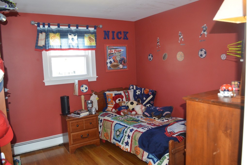 39 Miriam Road Waltham, MA 02451 - Photo 6 of 20 a bed room with a bed and a television