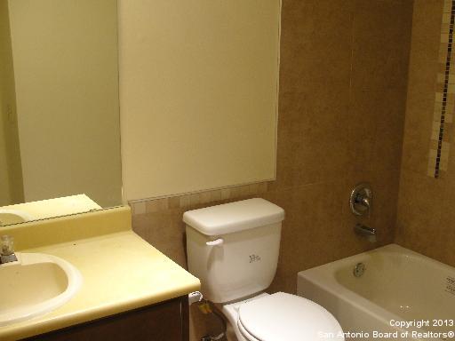 16307 Bitter Creek Street San Antonio, TX 78247 - Photo 6 of 12 a white toilet sitting next to a bathroom sink