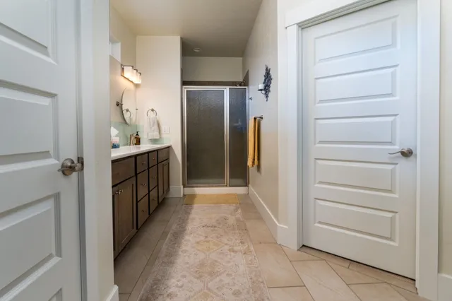 a view of hallway with cabinets