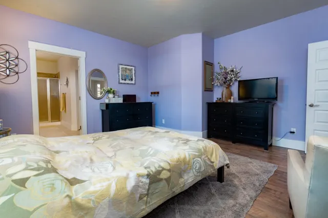 a bedroom with a bed and a dresser