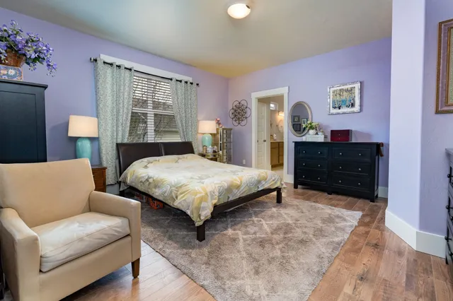 a bedroom with a bed and dresser