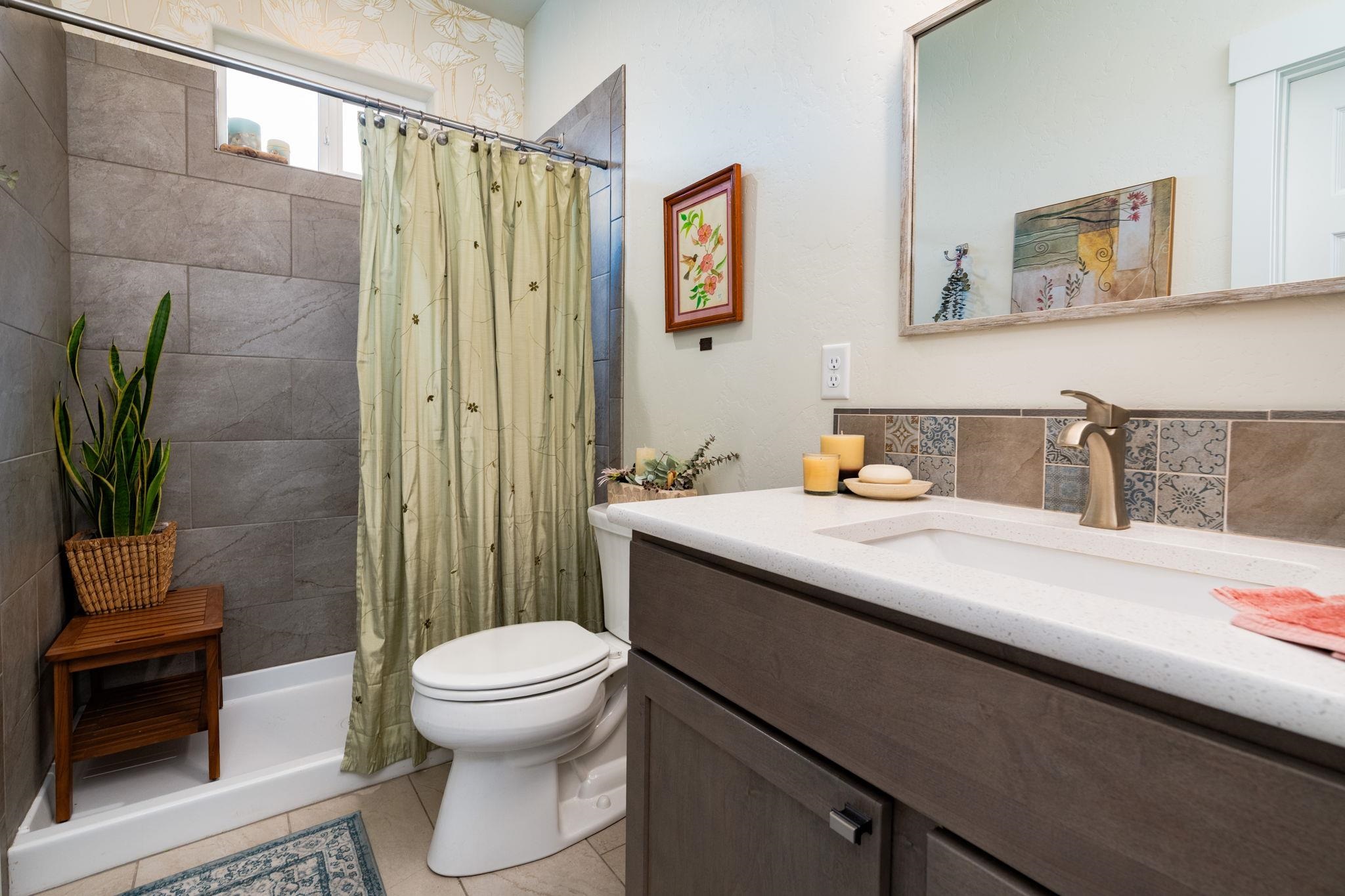 1222 Periwinkle Lane Fruita, CO 81521 - Photo 18 of 27 a bathroom with a sink toilet and shower