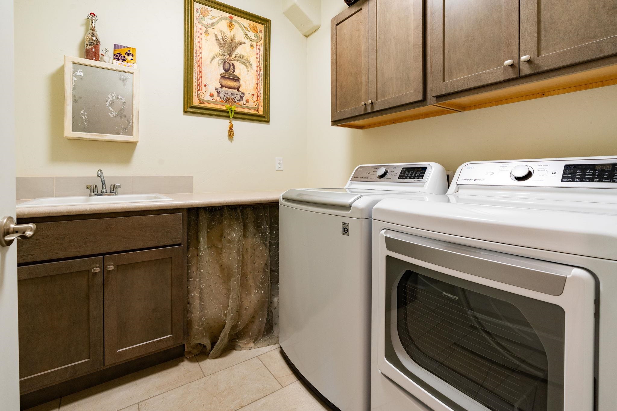 1222 Periwinkle Lane Fruita, CO 81521 - Photo 19 of 27 a utility room with dryer and washer