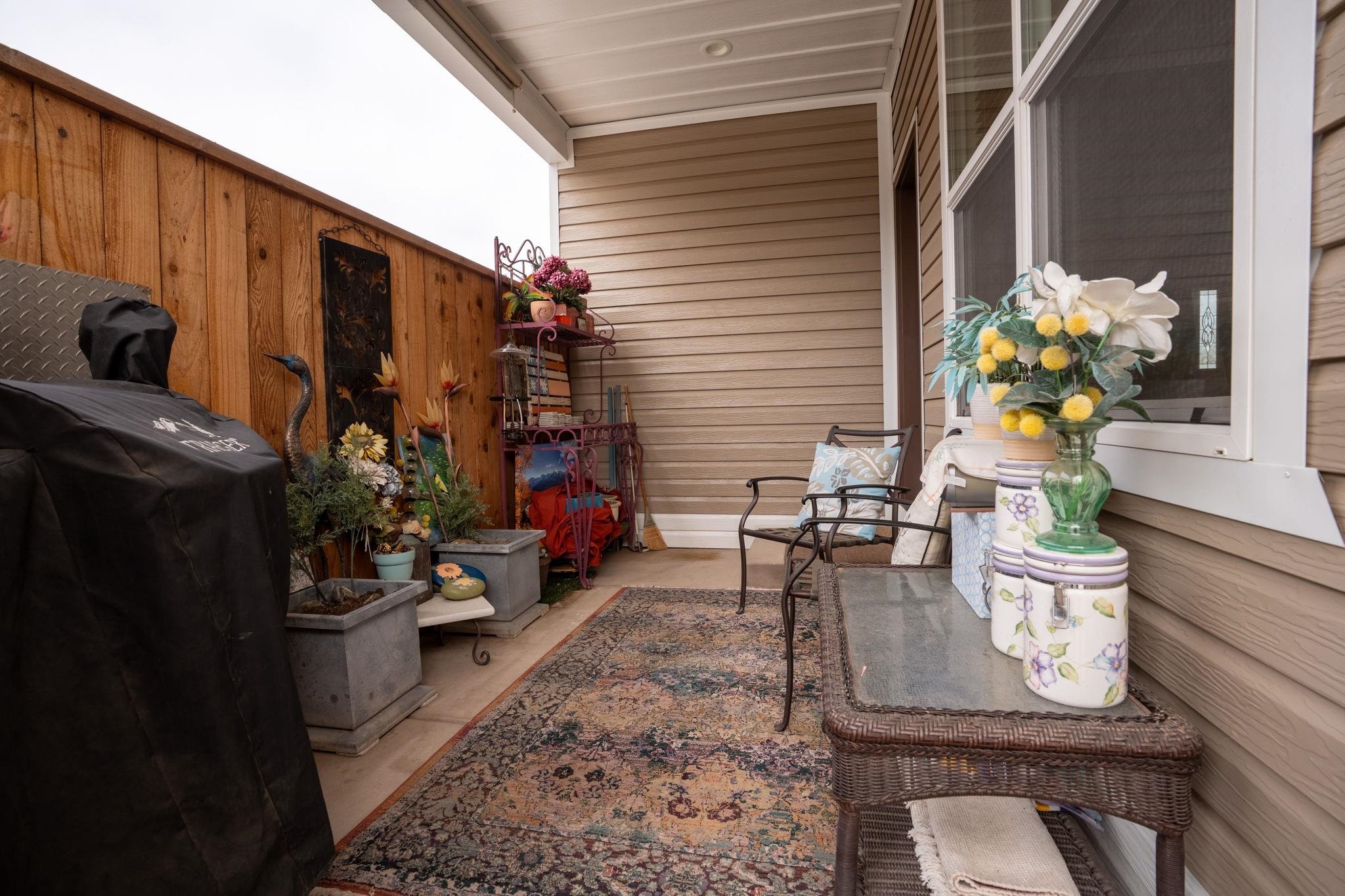 1222 Periwinkle Lane Fruita, CO 81521 - Photo 26 of 27 a table and chairs in front of the house