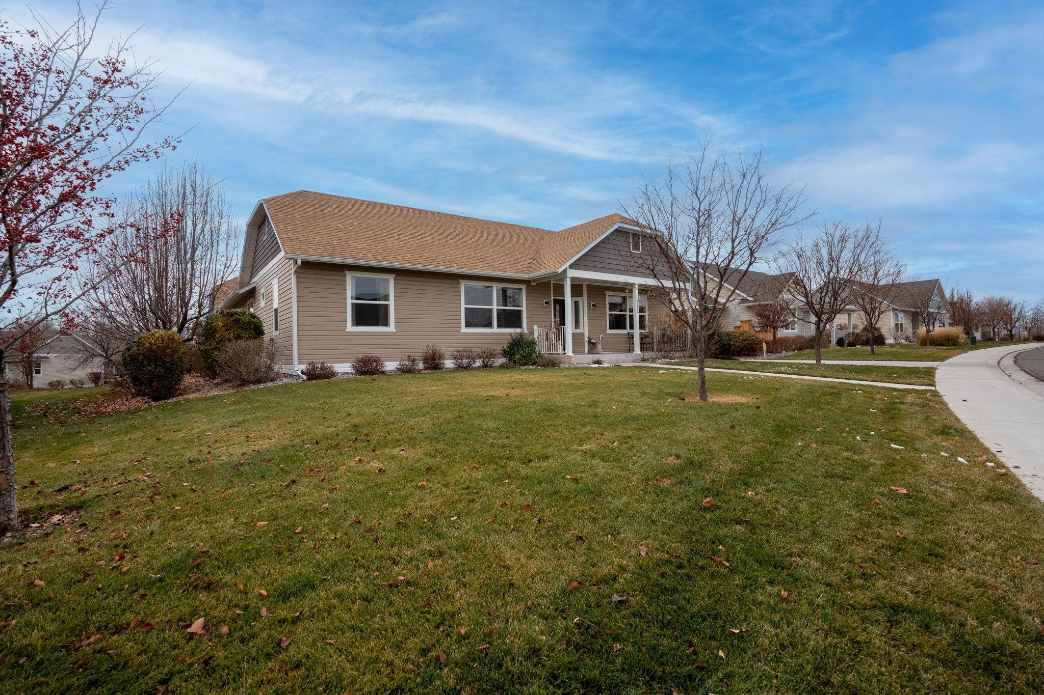 1222 Periwinkle Lane Fruita, CO 81521 - Photo 3 of 27 a front view of a house with a yard