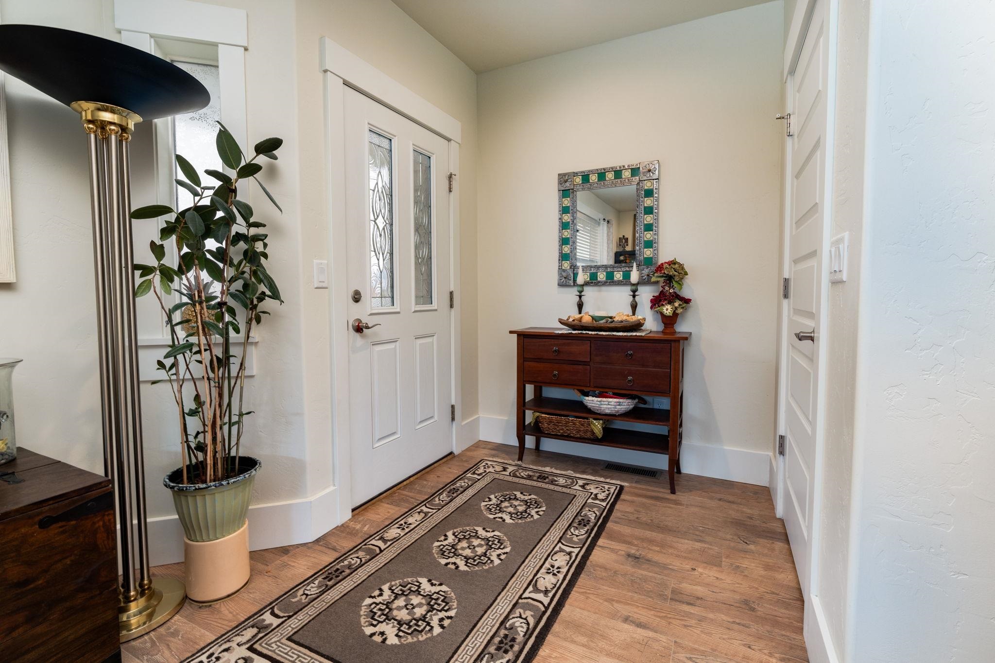 1222 Periwinkle Lane Fruita, CO 81521 - Photo 5 of 27 a living room with furniture and a potted plant