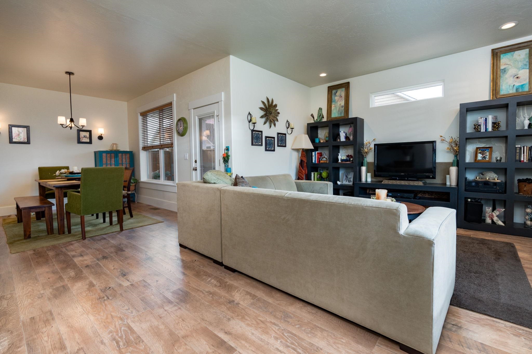 1222 Periwinkle Lane Fruita, CO 81521 - Photo 7 of 27 a living room with furniture and a flat screen tv