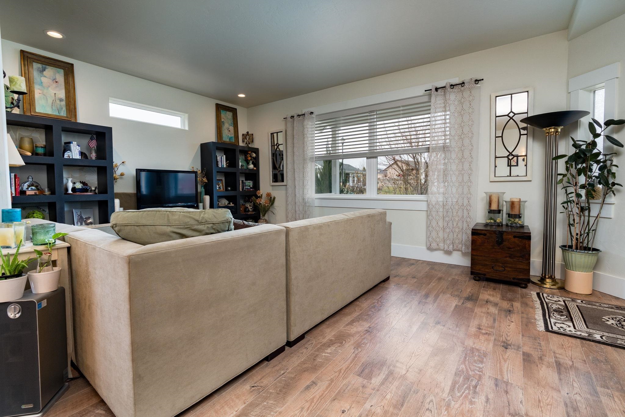 1222 Periwinkle Lane Fruita, CO 81521 - Photo 8 of 27 a living room with furniture and a flat screen tv