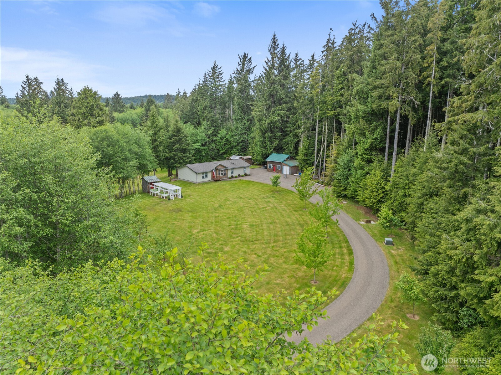 132 River Park Road Forks, WA 98331 - Photo 34 of 40 a view of a swimming pool with a yard