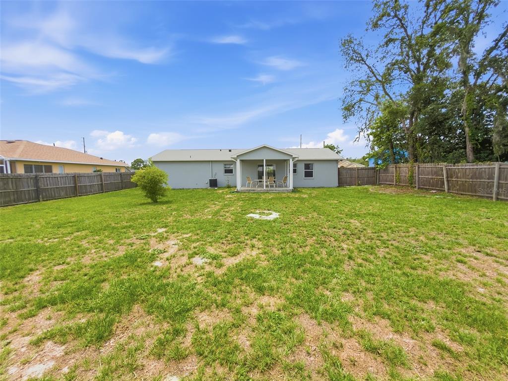 2202 Godfrey Avenue Spring Hill, FL 34609 - Photo 33 of 36 a view of a house with a yard