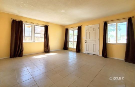 801 West Moyer Avenue Ridgecrest, CA 93555 - Photo 6 of 23 a view of an empty room with a window