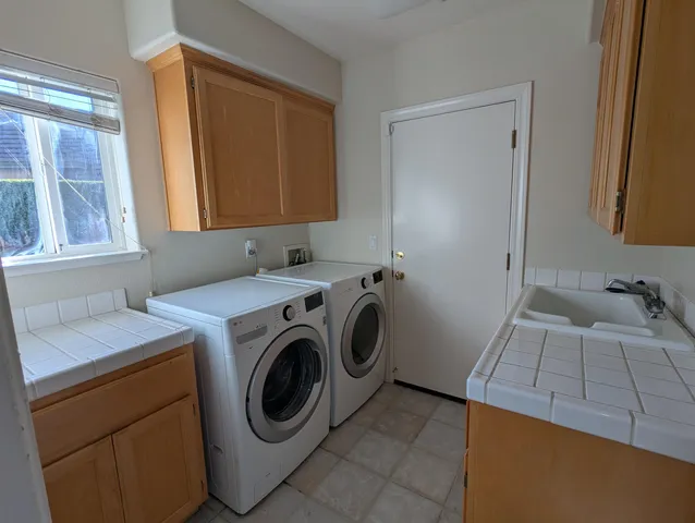 a utility room with dryer and washer