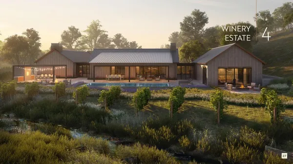 a front view of a house with a yard and lake view