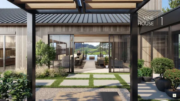 a view of a brick house with potted plants