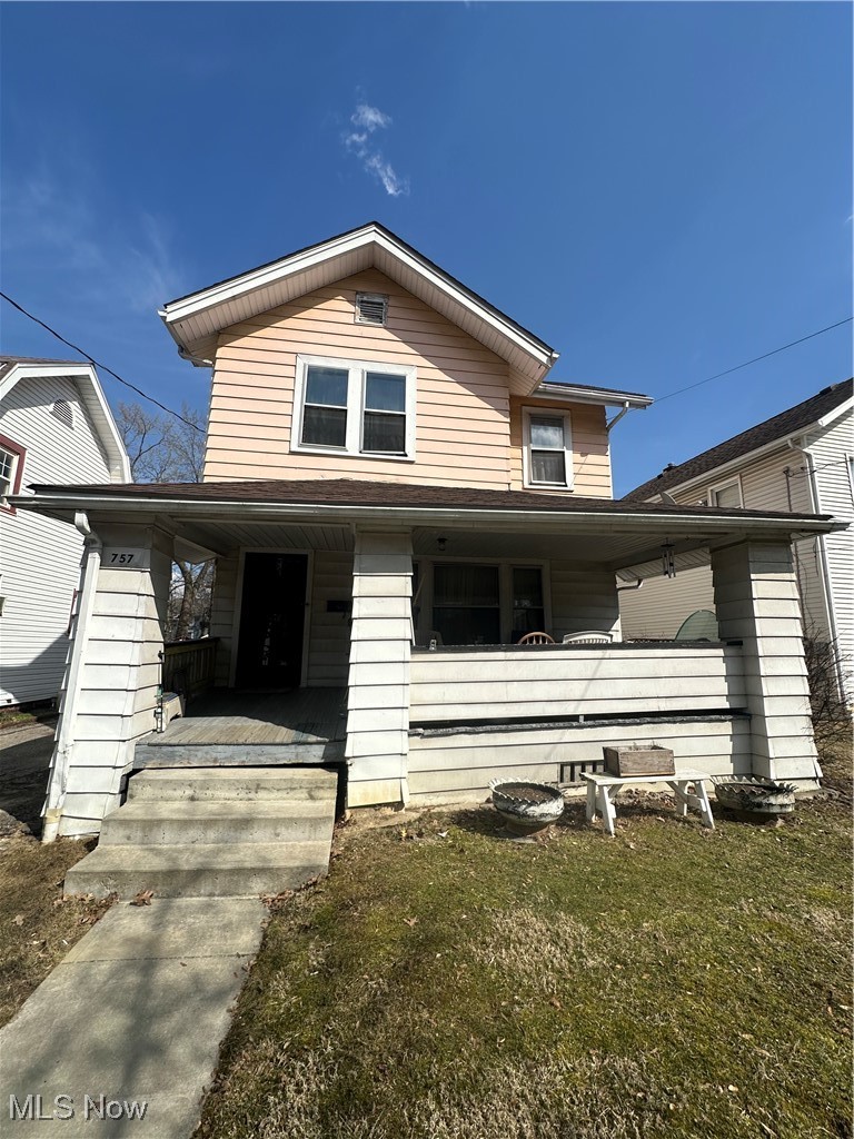 757 Noah Avenue Akron, OH 44320 - Photo 1 of 16 Traditional-style home featuring covered porch and a front lawn