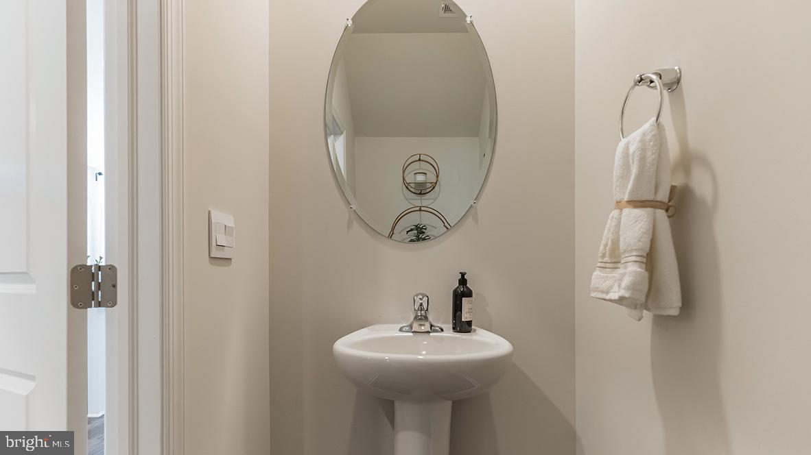 92 Arlotta Street Glassboro, NJ 08028 - Photo 23 of 25 a bathroom with a sink and mirror
