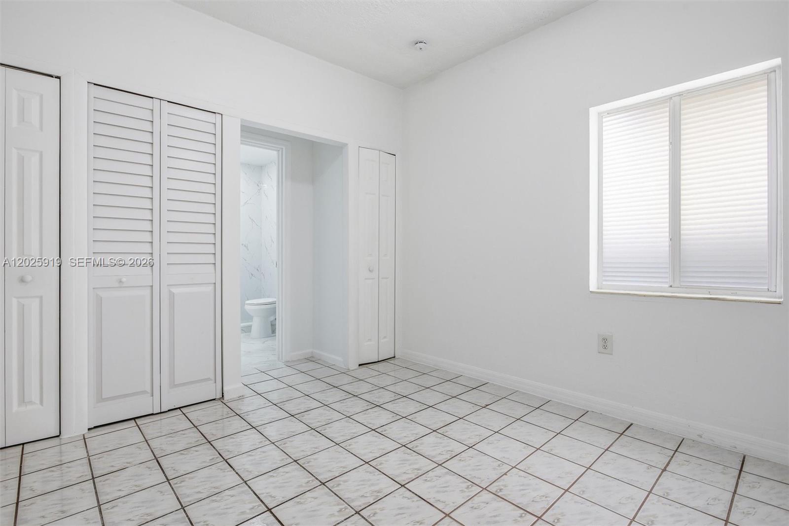1743 Southwest 17th Street, Unit 1 Miami, FL 33145 - Photo 15 of 32 a view of an empty room and window