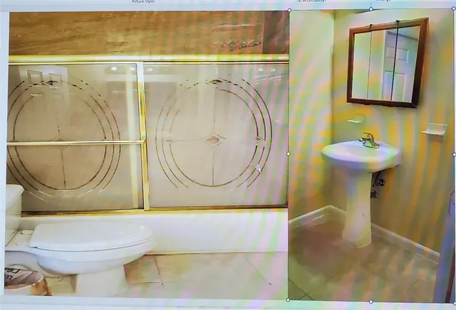 a bathroom with a toilet and a sink