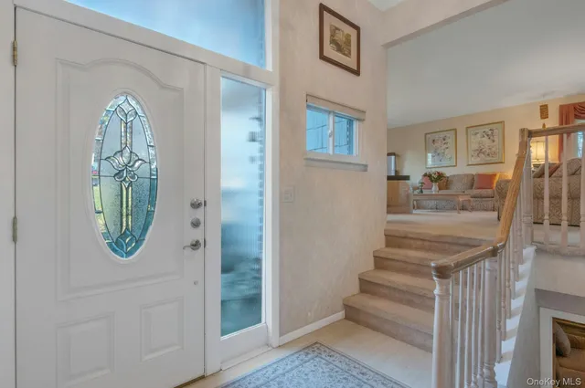 a view of a livingroom with furniture and entryway