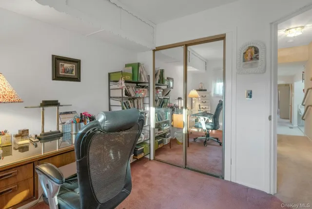 a workspace with wooden floor and furniture