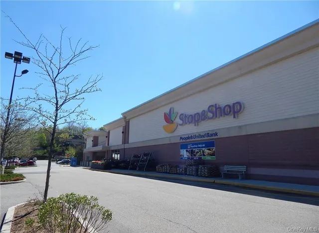 a view of outdoor space with sign board and garden