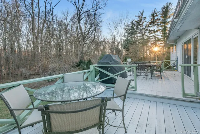 a view of outdoor kitchen with seating area